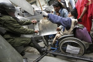 Disabled protestors in Bolivia fighting cops after a 1,000 mile march demanding guaranteed income.