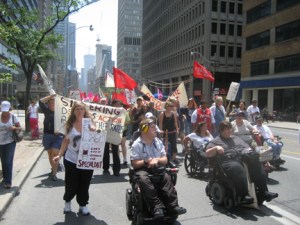 Wheelchair users lead Raise the Rates demo, leaving the rest behind.